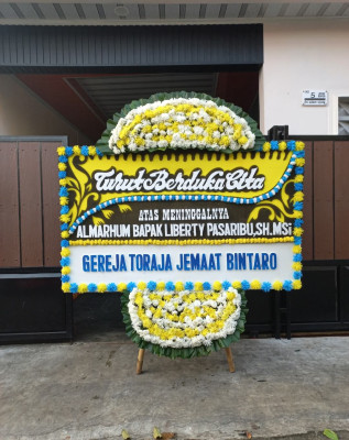 Papan Bunga Duka di Regol